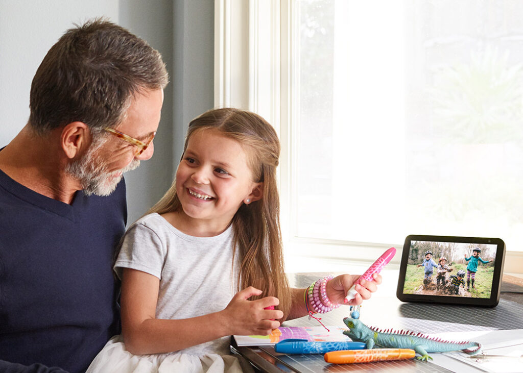 photo of a dad and child playing with an Echo Show